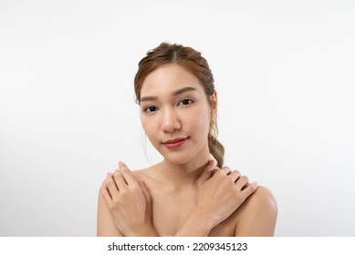 Beautiful Asian Woman, Natural Cosmetic Skincare Products Look At Camera, Smiling, Touching Face And Healthy Skin In Slow Motion, Wellness. Beauty Portrait.