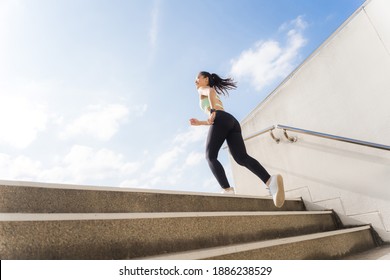 Beautiful asian woman outdoor exercise She un up the stairs - Powered by Shutterstock