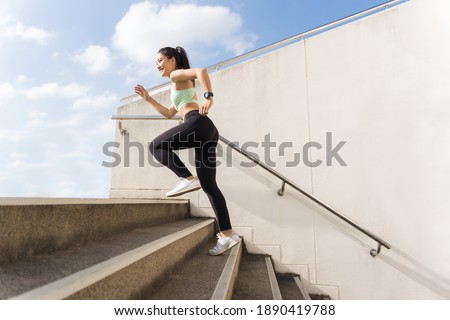 Beautiful asian woman outdoor exercise She un up the stairs