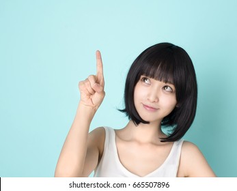 https://image.shutterstock.com/image-photo/beautiful-asian-woman-pointing-finger-260nw-665507896.jpg