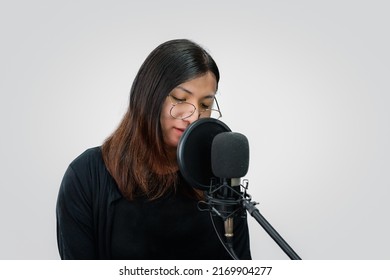 Beautiful Asian Woman   Singer. She Enjoying Sing A Song Or Karaoke In Music Studio With Microphone Condenser And Headphones For Fun Or Voice Creative