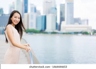 Beautiful Asian Woman Smile And Happy To Travel In Singapore City