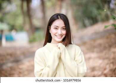 Beautiful Asian Woman Smiling Happy Girl And Wearing Warm Clothes Winter And Autumn Portrait At Outdoor In Park