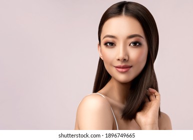 Beautiful Asian Woman With  Straight Hair. Beauty Chinese  Girl With Clean And White Skin. Fashion, Cosmetics And Makeup