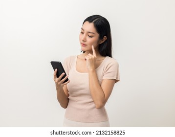 Beautiful Asian Woman Thinking Looking Smartphone. Female Standing Pose On Isolated White Background. Attractive Teenage Girl Around 25