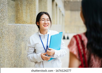 Beautiful asian woman tour guide talking to traveler and giving travel infomation. - Shutterstock ID 1676124277