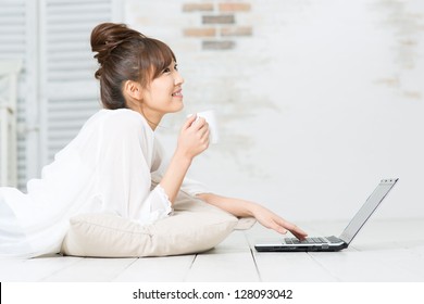 Beautiful Asian Woman Using A Laptop Computer