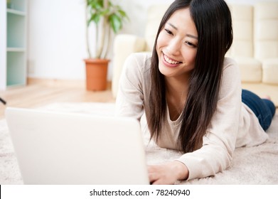 Beautiful Asian Woman Using Laptop Computer