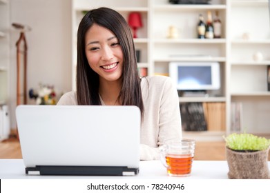 Beautiful Asian Woman Using Laptop Computer