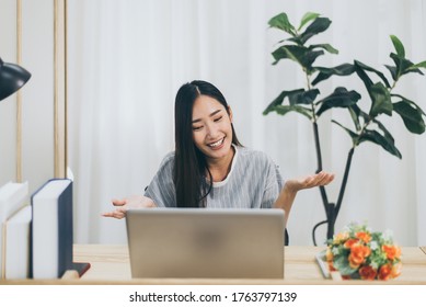 Beautiful Asian Woman Using Video Conference Call To People,Work From Home,Work At Home,New Normal Concept