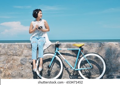 Beautiful Asian Woman With Vintage Bicycle And Vintage Camera,travel Concept 