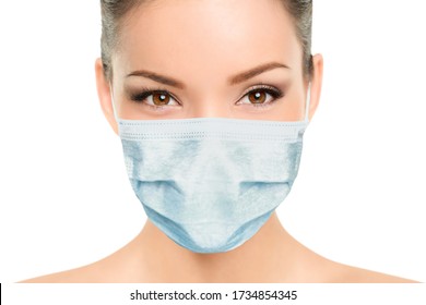 Beautiful Asian woman wearing medical face mask with eyes makeup beauty model portrait isolated on white background for Coronavirus.