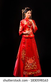 Beautiful Asian Woman Wearing Red Period Wedding Costume In Dark Background