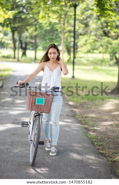 woman push bike