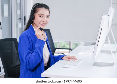 beautiful asian woman working call center operator with headset in office or workplace