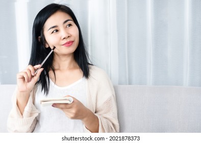 Beautiful Asian Woman Writing, Planning To Do List On Notepad Smiling And Thinking Of Goal Plan, Inspiration 