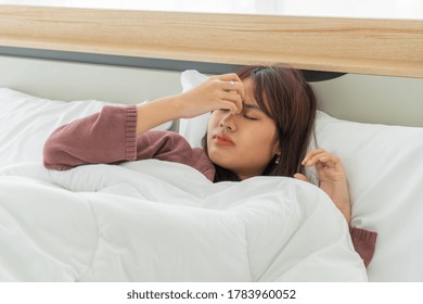 Beautiful Asian Women Headache And Sleeping On Bed