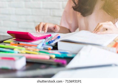 Beautiful Asian Women Are Pressing A Calculator To Calculate The Cost To Plan On Paying Taxes At The End Of The Year , Financial And Business Concept.