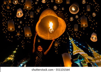 Beautiful asian women release sky lanterns to worship buddha's relics in yi peng or yee peng festival at Wat Jongklang temple - Wat Jongkham temple in Mae hong son near Chiang mai, Thailand.