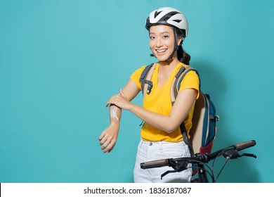 Beautiful asian women She is cycling in the sun. She applied the cream and lotion.studio concept - Powered by Shutterstock