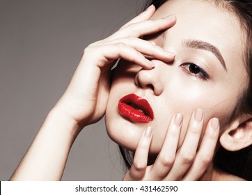 Beautiful Asian Young Model With Red Lips And Natural  Manicure, Fashion Model