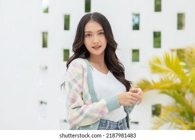 Beautiful Asian Young Woman Smile And Cheerful. Confident Cute Female Looking At Camera Relax And Happiness With Wellness Life. Good Moment And Positive Emotional. Happy Woman Enjoy Her Life Concept