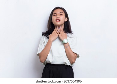 beautiful asian young woman with sore throat neck and shoulder pain isolated on a white background
