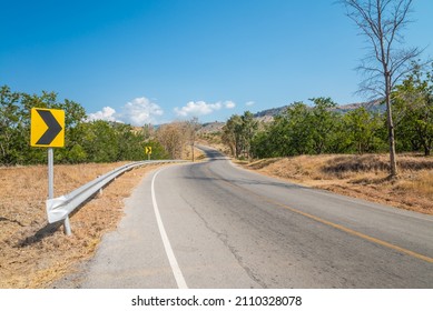 Beautiful Asphalt Country Road Side On The Green Mountain With Blue Sky Background In Sunny Day, Phetchabun Thailand. Road Trip, Travel Holiday Or Transportation Concept.