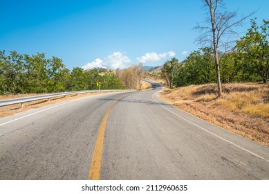 Beautiful Asphalt Country Road Side On The Green Mountain With Blue Sky Background In Sunny Day, Phetchabun Thailand. Road Trip, Travel Holiday Or Transportation Concept.