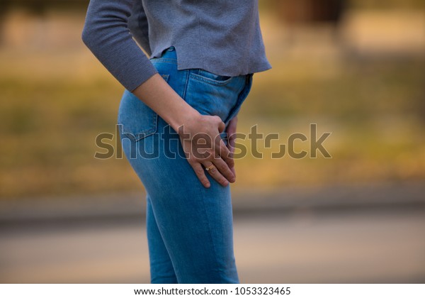 ass and a butt in jeans walking