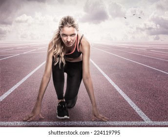 Beautiful athlete on a race track is ready to run - Powered by Shutterstock