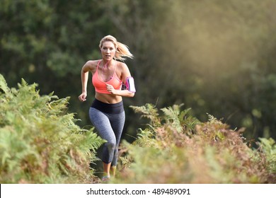 Beautiful Athletic Woman Running In Forest