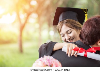 Beautiful Attractive Asian Female Student In Cap And Gown And Family Hug Celebrating Graduation ,feeling So Proud And Happiness In Commencement Day,Education Success Concept