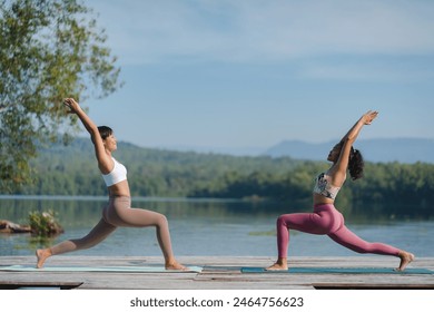 Beautiful attractive Asian woman practice fitness yoga pose on the pool above the Mountain peak in front of nature lake views, Feel so comfortable lifestyle and relax exercise in holiday morning - Powered by Shutterstock