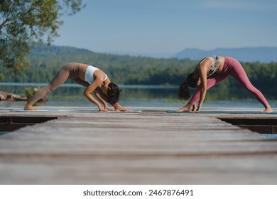 Beautiful attractive Asian woman practice fitness yoga pose on the pool above the Mountain peak in front of nature lake views, Feel so comfortable lifestyle and relax exercise in holiday morning - Powered by Shutterstock