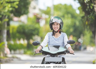 Beautiful Attractive Asian Woman Riding Motorcycle In The City Street