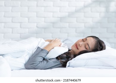 Beautiful Attractive Asian Woman Sleep And Sweet Dream Lying On Bed In Cozy Bedroom In The Morning Feeling So Relax And Comfortable.Healthy Young Female Sleep With Bedtime At Home.Healthcare Concept