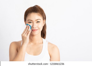 Beautiful Attractive Asian woman using Facial oil clean film to removal oil on face for face fresh skin feeling so fresh and clean,Beauty Concept,Isolated on grey background