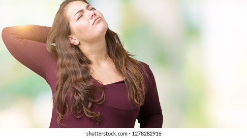 Beautiful and attractive plus size young woman wearing a dress over isolated background stretching back, tired and relaxed, sleepy and yawning for early morning - Shutterstock ID 1278282916