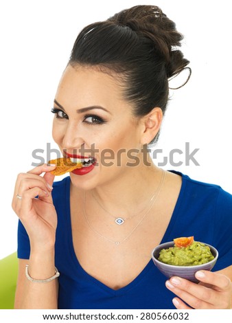Beautiful Attractive Young Hispanic Woman Holding A Small Bowl Of Homemade Guacamole Against A White Background