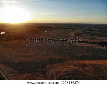 Similar – Sommer August Feld zur Erntezeit bei Sonnenuntergang Sonnenlicht