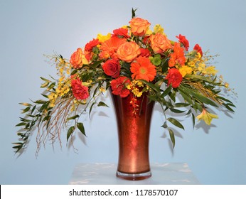 A Beautiful Autumn Floral Arrangement Of Orange Roses, Chrysanthemums And Lilies