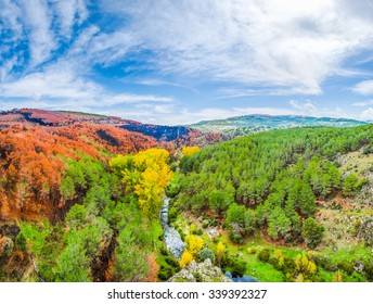 Beautiful autumn landscape with colorful forests and blue sky near Madrid in the autonomous community of Castilla y Leon, Spain