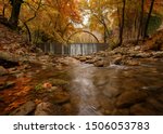 Beautiful autumn landscape.The old stone bridge of Palaiokarya and the waterfall! Trikala prefecture, Thessaly, Greece