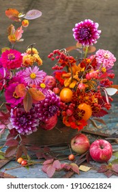 Beautiful Autumn Pink Red Orange Bouquet With Dahlia, Fall Flowers, Colorful Leaves And Apples	