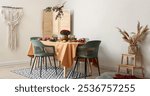 Beautiful autumn table setting with bouquet of flowers and pumpkins in light dining room