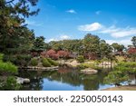 the beautiful autumn view in Shukkei-en, a historic Japanese garden in the city of Hiroshima, Japan. Construction began in 1620 during the Edo period.