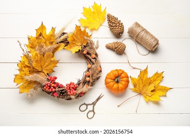 Beautiful Autumn Wreath With Craft Supplies On White Wooden Background