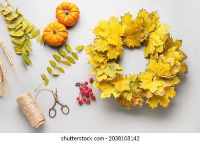 Beautiful Autumn Wreath With Craft Supplies On Grey Background