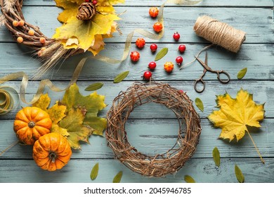 Beautiful Autumn Wreaths With Craft Supplies On Color Wooden Background